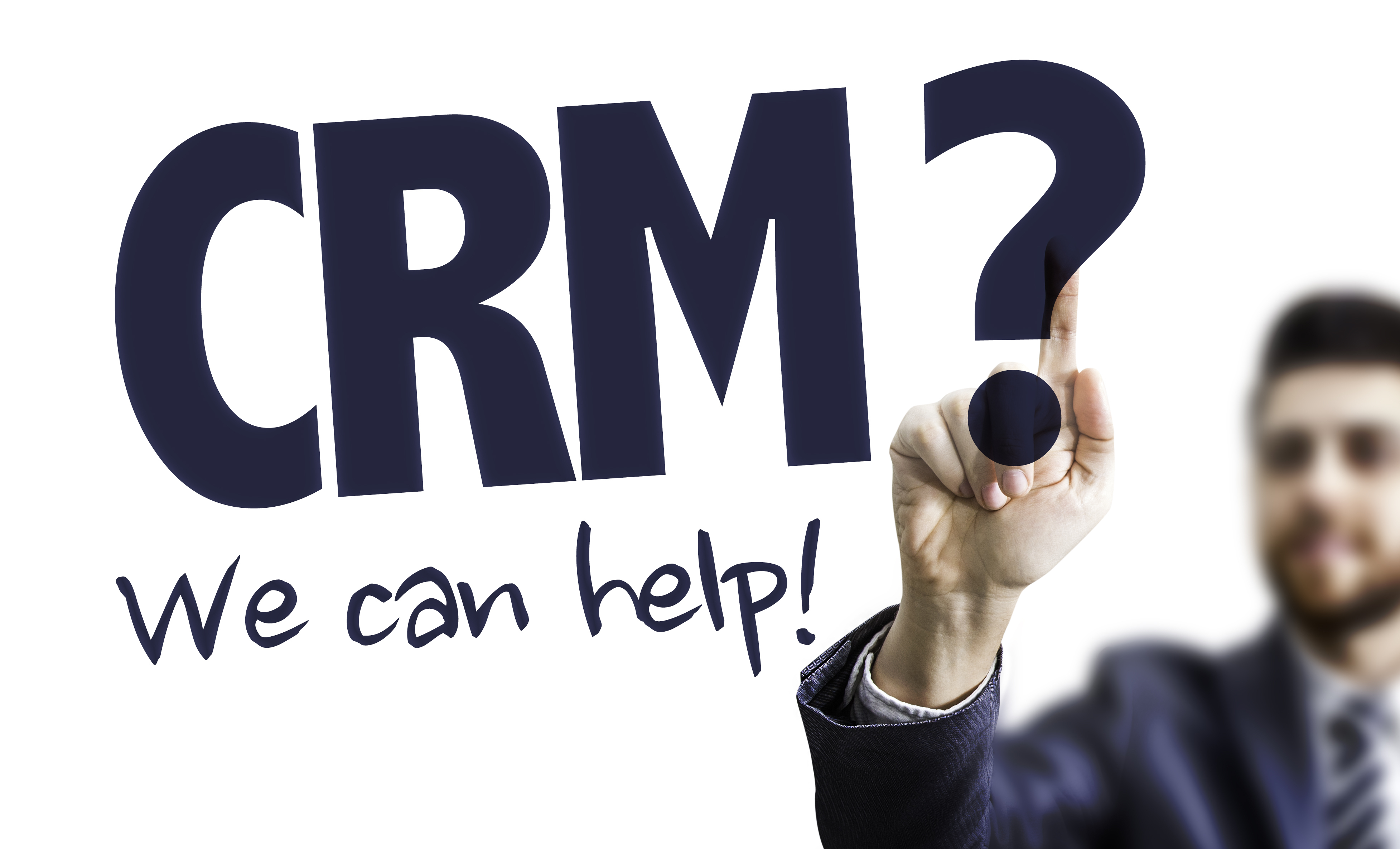 Business Man Pointing the Text: CRM? We Can Help!
